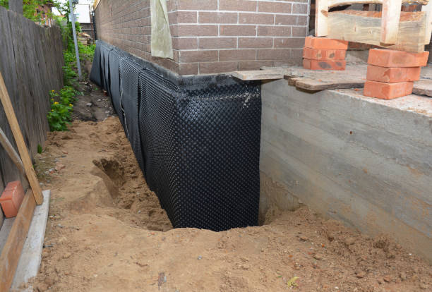 SJ Waterproofing Pros technician performing targeted Basement Waterproofing assessment in Milton, KY